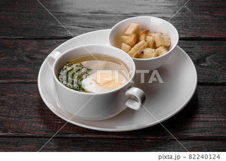 Asian noodle soup, ramen with chicken, vegetables and egg in white bowl 82240124