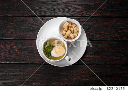 Asian noodle soup, ramen with chicken, vegetables and egg in white bowl Asian noodle soup, ramen with chicken, vegetables and egg in white bowl 82240126