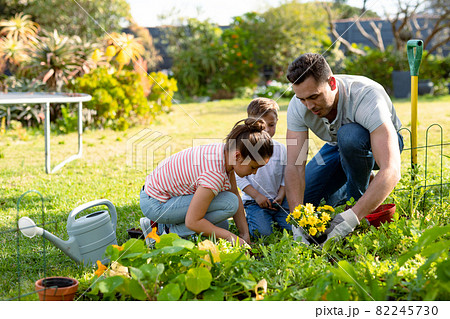 Happy caucasian father, daughter and son gardening together 82245730