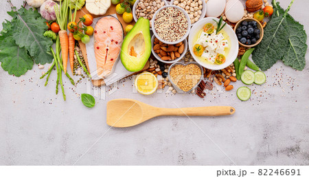 Ketogenic low carbs diet concept. Ingredients for healthy foods selection set up on white concrete background. Ketogenic low carbs diet concept. Ingredients for healthy foods selection set up on white concrete background. 82246691