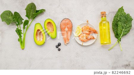 Ketogenic low carbs diet concept. Ingredients for healthy foods selection set up on white concrete background. Ketogenic low carbs diet concept. Ingredients for healthy foods selection set up on white concrete background. 82246692