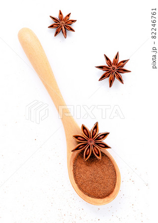 Close up chinese star anise in wooden spoon isolate on white background. Dried star anise spice fruits top view and copy space. Close up chinese star anise in wooden spoon isolate on white background. Dried star anise spice fruits top view and copy space. 82246761
