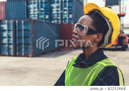 Young African American woman worker at overseas shipping container yard 82252668