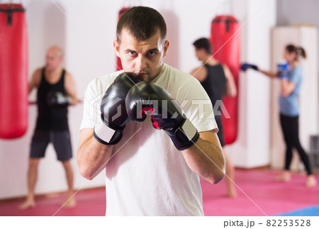 sportsman training in boxing gloves sportsman training in boxing gloves 82253528