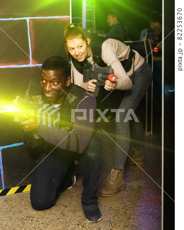 Adult laser tag players during lasertag game 82253670