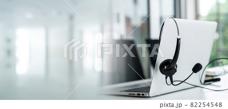Headset and customer support equipment at call center ready for actively service 82254548