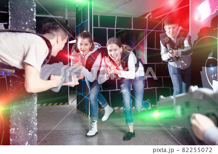 Young people playing laser tag 82255072