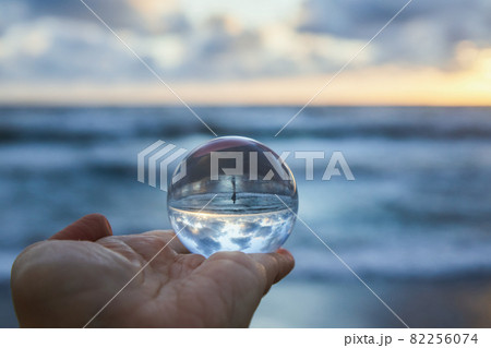 Magic sphere. Fortune teller, mind power concept. Crystal Ball reflecting water and sky. Magic sphere. Fortune teller, mind power concept. Crystal Ball reflecting water and sky. 82256074