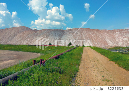 View of large industrial mountains of spent ore, mining. 82256324