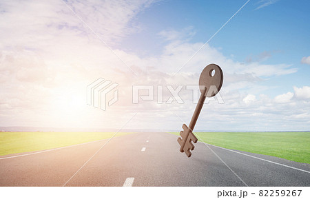 Conceptual background image of concrete key sign on asphalt road Conceptual background image of concrete key sign on asphalt road 82259267