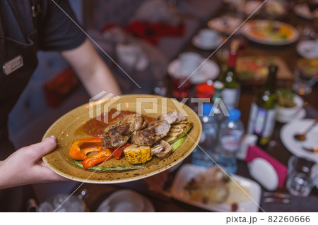 Grilled Steak Striploin and Pepper sauce on cutting board on dark wooden background. Grilled Steak Striploin and Pepper sauce on cutting board on dark wooden background. 82260666