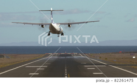 Jetliner landing on runway by the sea Jetliner landing on runway by the sea 82261475