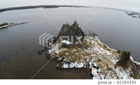 Flying over the township on coast in winter Flying over the township on coast in winter 82264385
