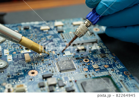 Repairing inside of hard disk by soldering iron. Integrated Circuit. the concept of data, hardware, technician and technology. 82264945