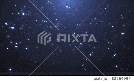 キラキラした粒々の星とパーティクルの宇宙背景のイラスト素材