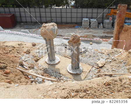 PENANG, MALAYSIA -SEPTEMBER 2, 2021: The process of cutting piles after the completion of building foundation piling work. This work needs to be done before the construction of the cap pile is proceed PENANG, MALAYSIA -SEPTEMBER 2, 2021: The process of cutting piles after the completion of building foundation piling work. This work needs to be done before the construction of the cap pile is proceed 82265356