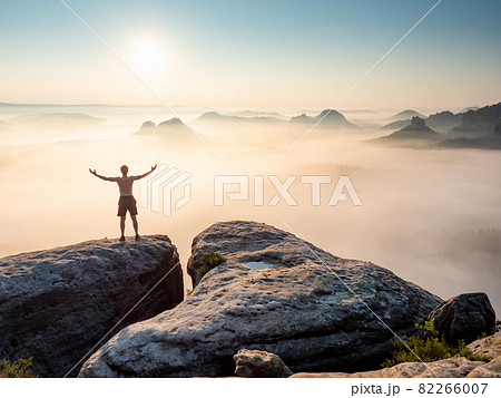 Silhouette of nature lover man with raised arms on the mountain sharp edg 82266007
