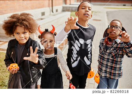 African American Kids Trick or Treating in Street African American Kids Trick or Treating in Street 82266018