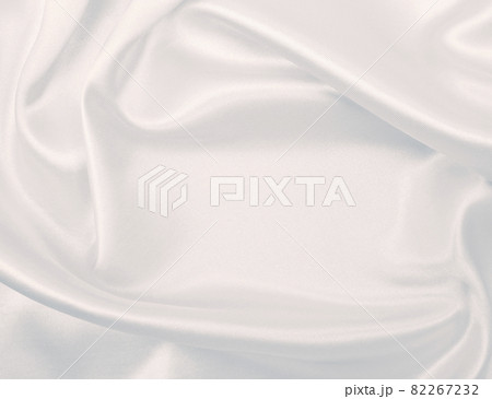 Smooth elegant grey silk or satin luxury cloth as wedding background. Luxurious background design Smooth elegant grey silk or satin luxury cloth as wedding background. Luxurious background design 82267232