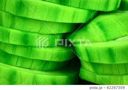 green zucchini sliced into wheels green zucchini sliced into wheels 82267309