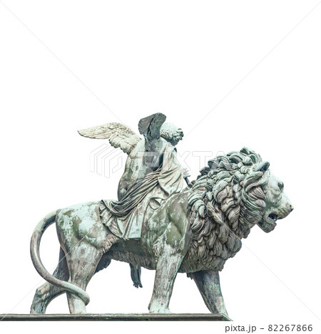 Statue of a big lion with genius of music, an angel with wings and a musical instrument at Concert Hall (Konzerthaus), in Berlin, Germany, isolated at white background. 82267866