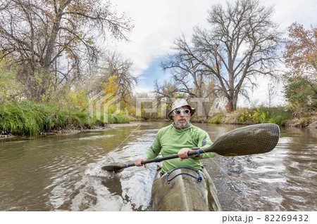 paddling sea kayak on a river 82269432