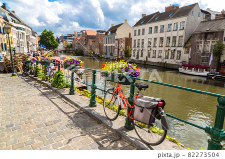 Bicycles parked by the canal in Gent 82273504