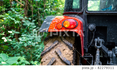 Rear view of a tractor in the nature Rear view of a tractor in the nature 82279311