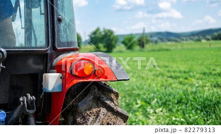 Rear view of a tractor in the nature 82279313