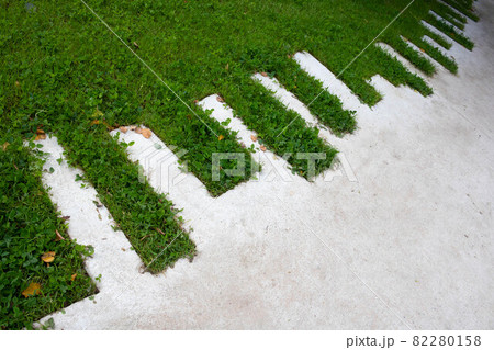 Green lawn and concrete zigzag path in the park 82280158