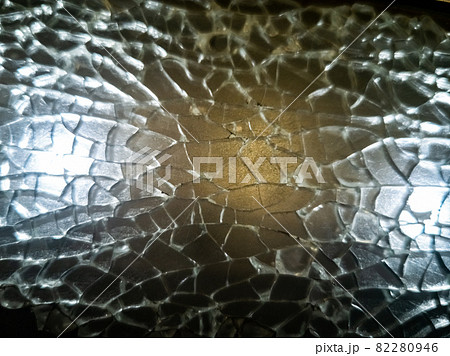 texture broken glass window. shards highlighted. close-up texture broken glass window. shards highlighted. close-up 82280946