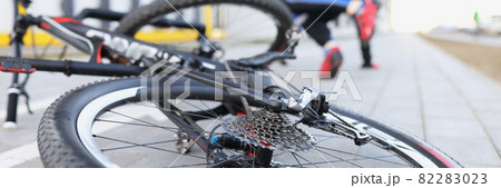 Man in sports uniform falling from bicycle closeup Man in sports uniform falling from bicycle closeup 82283023