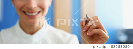 Business woman holding silver ballpoint pen closeup 82283080