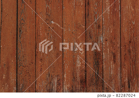 Gray wood texture with traces of paint. Abstract background, blank template. rustic weathered wood barn background with scratches, nails and knots. Cover the walls with wooden boards. Copy space. 82287024