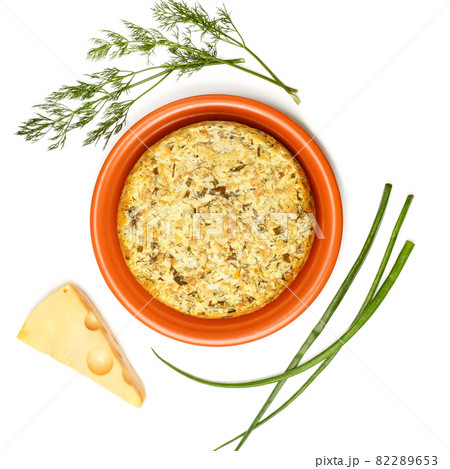Cheese casserole with herbs isolated on white . Cheese casserole with herbs isolated on white . 82289653