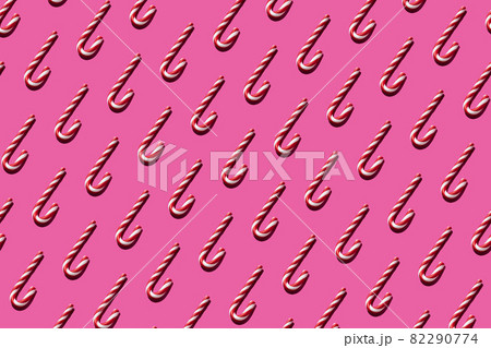 Christmas seamless candy cane pattern on pink background Christmas seamless candy cane pattern on pink background 82290774
