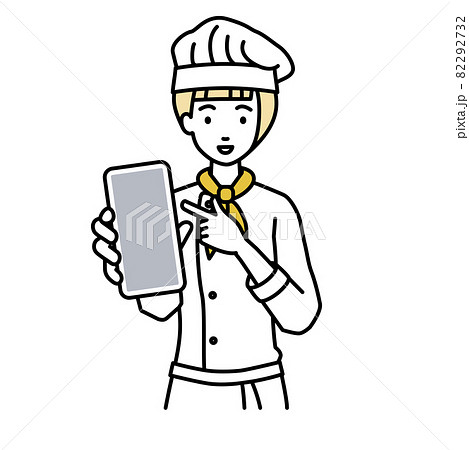 立ってスマートフォンを指差してこちらに向けて見せている調理師の女性 立ってスマートフォンを指差してこちらに向けて見せている調理師の女性 82292732