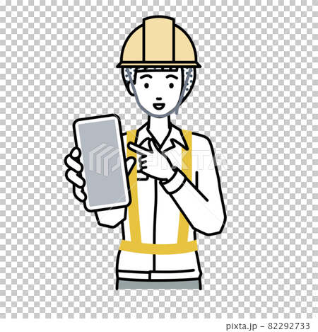 A woman at a construction site standing and pointing at her smartphone A woman at a construction site standing and pointing at her smartphone 82292733