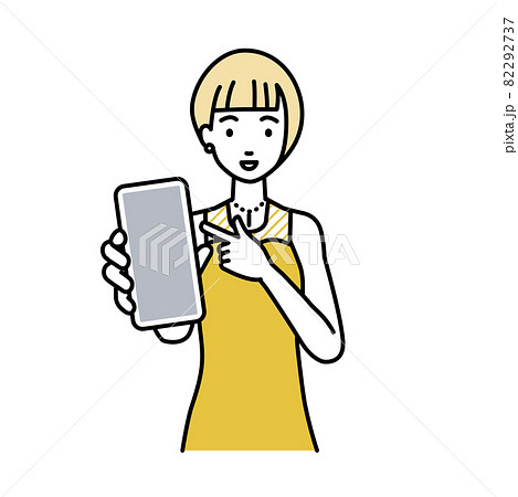 立ってスマートフォンを指差してこちらに向けて見せているドレスの女性 立ってスマートフォンを指差してこちらに向けて見せているドレスの女性 82292737