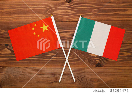 Flag of China and flag of Italy crossed with each other. China vs Italy 82294472