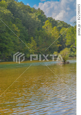 The Current River flows through the Ozark National Scenic Riverway through the mountains of Missouri The Current River flows through the Ozark National Scenic Riverway through the mountains of Missouri 82296005