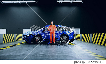 Robot crash test dummy sitting near destroyed car crash test. Future concept. 3d rendering. 82298612