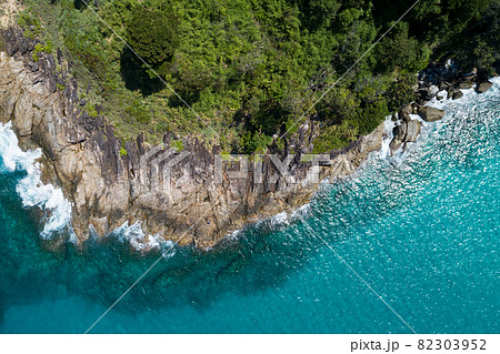 Aerial view Top down seashore wave crashing on seashore Beautiful turquoise sea surface in sunny day Good weather day summer background Amazing seascape top view 82303952