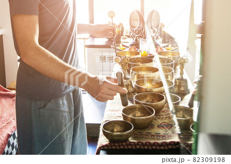 Tibetan singing bowls in sound therapy in spa center 82309198
