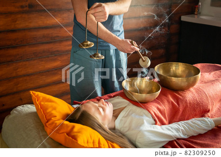 Tibetan singing bowls in sound therapy in spa center 82309250