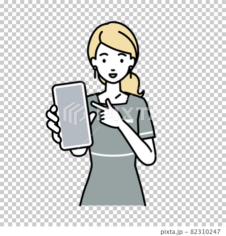 立ってスマートフォンを指差してこちらに向けて見せているエステ店員の女性 82310247