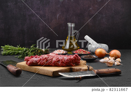 Raw lamb boneless neck meat on cutting board Raw lamb boneless neck meat on cutting board 82311667