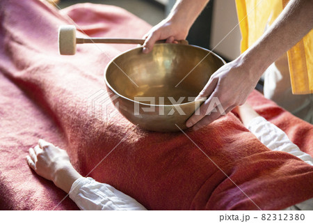 Tibetan singing bowls in sound therapy in spa center 82312380