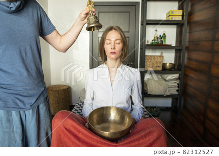 Tibetan singing bowls and bell in sound therapy in spa center 82312527