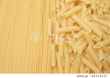 Different types of pasta dry on the white background Different types of pasta dry on the white background 82314137